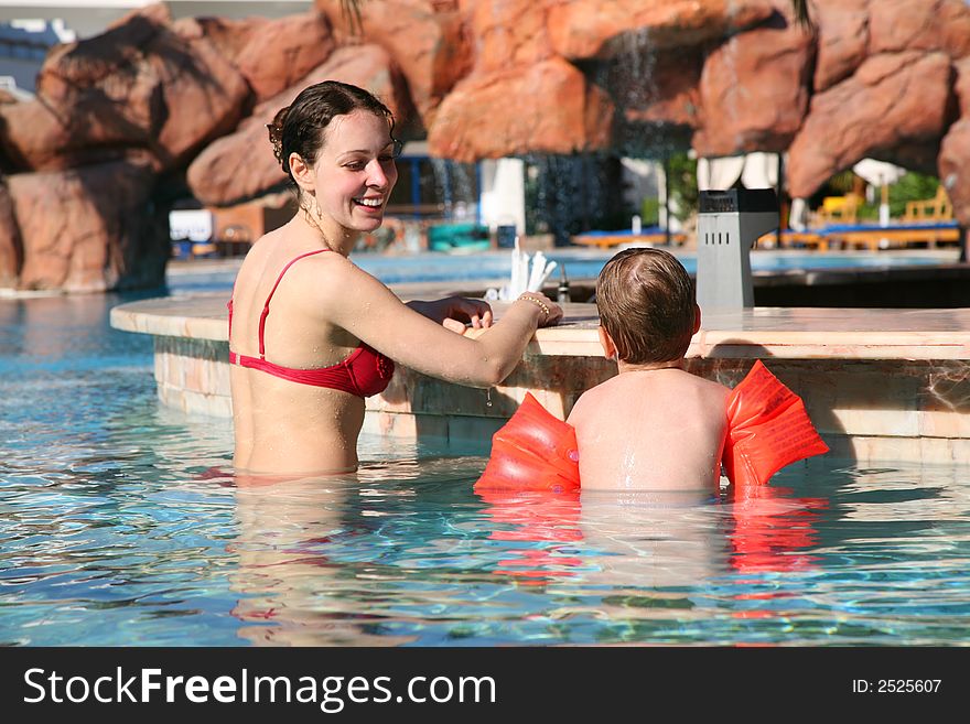 Mother with son at pool