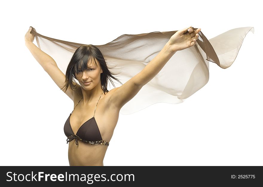 Young, woman wearing bikini and holding shawl. Hands up. Isolated on white in studio. Looking at camera. Young, woman wearing bikini and holding shawl. Hands up. Isolated on white in studio. Looking at camera
