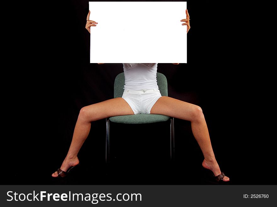 Isolated girl on chair with white paper in her hand