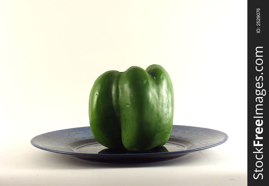 Delicious looking Green pepper on a plate. Delicious looking Green pepper on a plate
