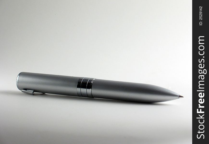 A silver ballpoint pen shown on white background. A silver ballpoint pen shown on white background