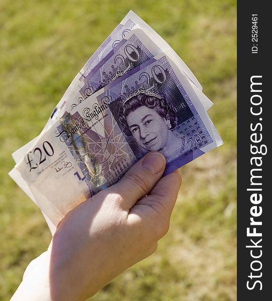 Handful of twenty pound notes. Handful of twenty pound notes