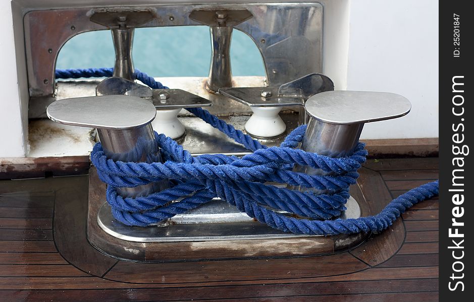 Ship rope texture wave closeup background helix on wood rolled on metal drum. Swirl blue spiral marine tool. Industry object design. Travel pattern.