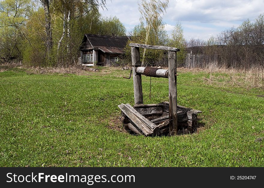 Old wooden well in russian village