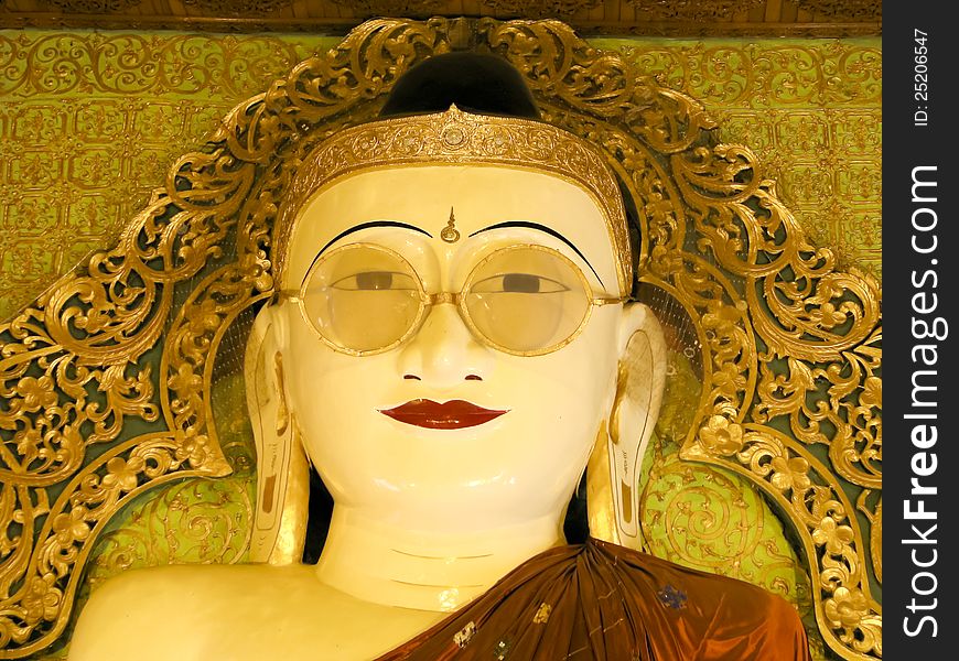 Buddha wearing spectacles in lower Myanmar.