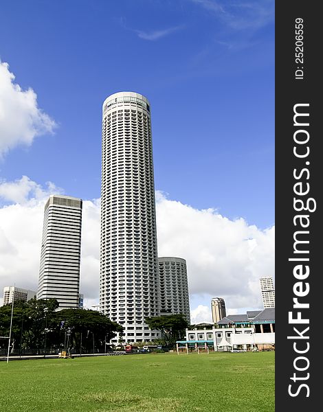 Singapore city under blue sky and green lawn. Singapore city under blue sky and green lawn