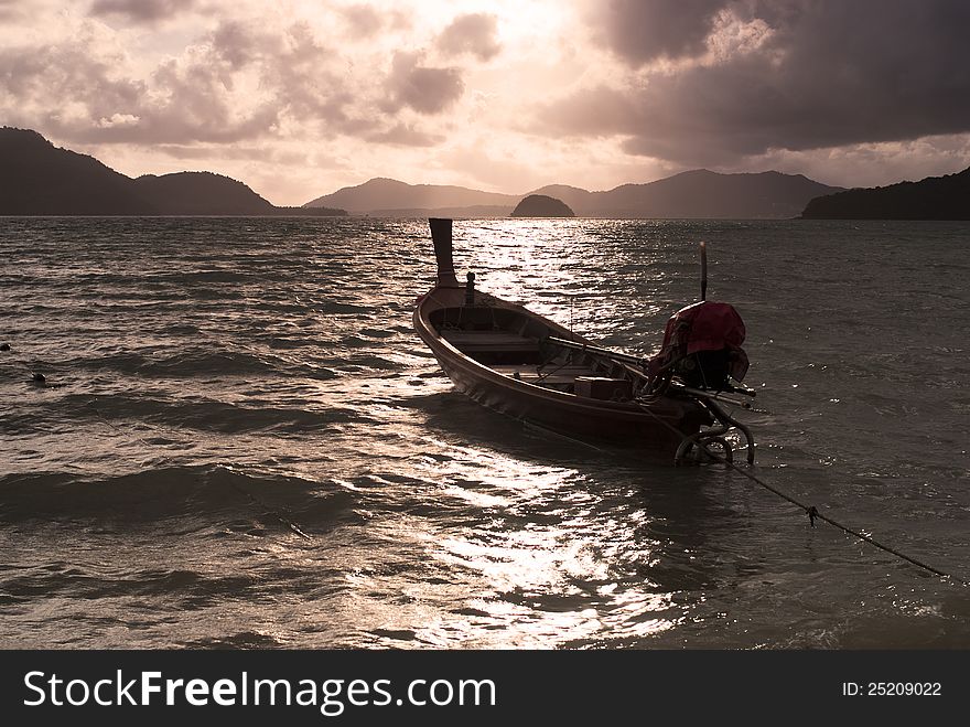 Silhouette of a boat in the sea at sunset. Silhouette of a boat in the sea at sunset