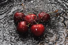 Red Cherries In Water Stock Photos