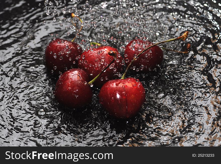Red cherries in moving water. Red cherries in moving water
