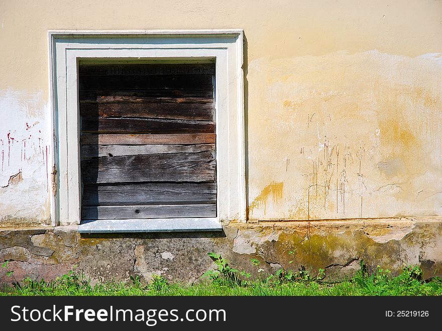 Boarded up window of an old building