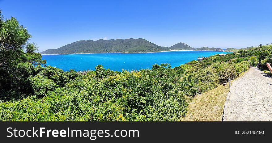 blooming blue sea in front of the lighthouse island in arraial do cabo