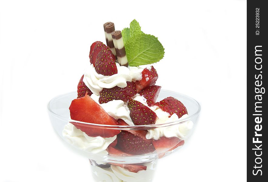 Balls of ice cream decorated with mint on a white background in the restaurant