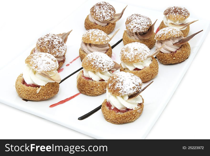 Tartlets on a white plate in a restaurant