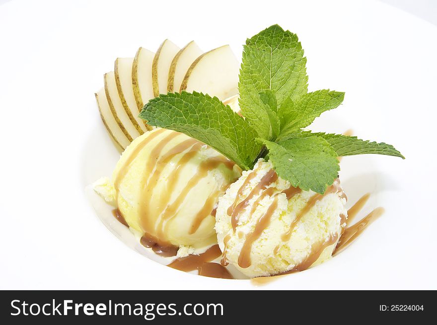 Ice cream with caramel sauce and mint on a white background