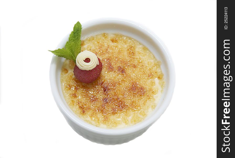 Creme brulee on a white background in the restaurant. Creme brulee on a white background in the restaurant