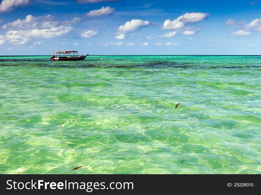 Sailing boat over clear turquoise water, Zanzibar, Tanzania. Sailing boat over clear turquoise water, Zanzibar, Tanzania