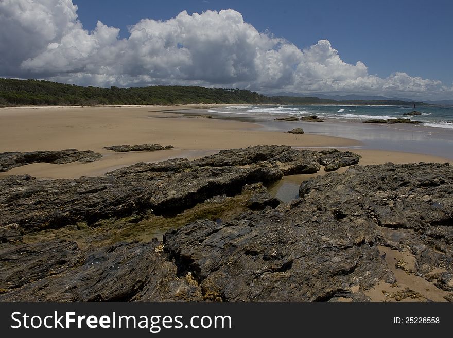 Image shows a view north of a quiet section of coastline on the north coast of NSW Australia. Image shows a view north of a quiet section of coastline on the north coast of NSW Australia