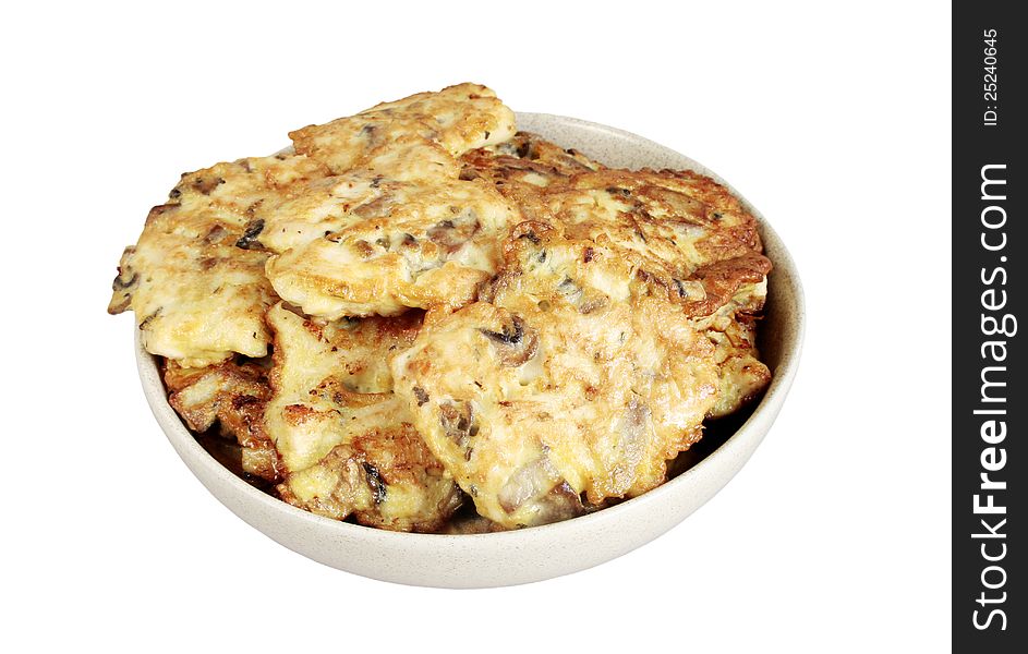 Cutlets from chicken,mushrooms and eggs in ceramic bowl isolated over white. Cutlets from chicken,mushrooms and eggs in ceramic bowl isolated over white