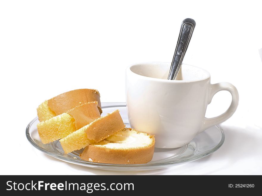 Coffee cup with cake on white background