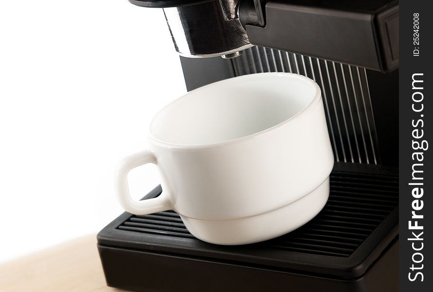 Coffee maker machine with white coffee cup