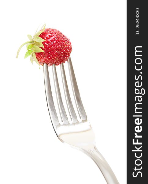 Fork with fresh Strawberry on a white background. Fork with fresh Strawberry on a white background