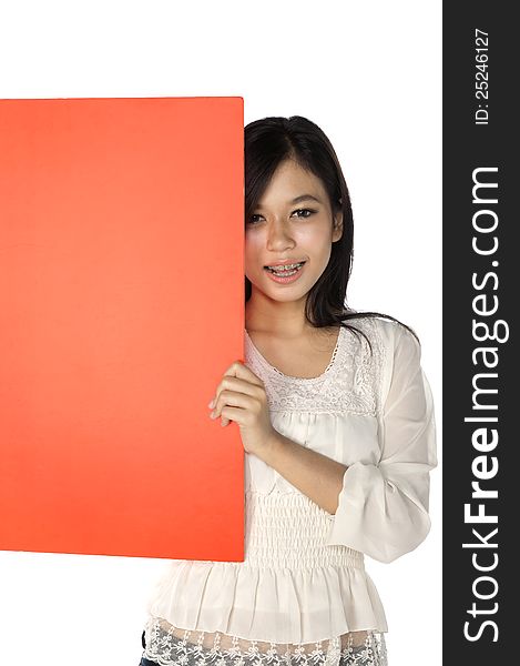 Beautiful woman hold blank red banner isolated over white background. You can put your message on the banner. Beautiful woman hold blank red banner isolated over white background. You can put your message on the banner
