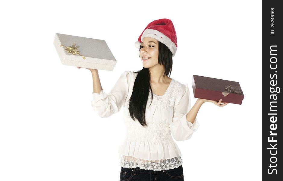 Woman wearing santa hat hold gift box isolated over white background. Woman wearing santa hat hold gift box isolated over white background