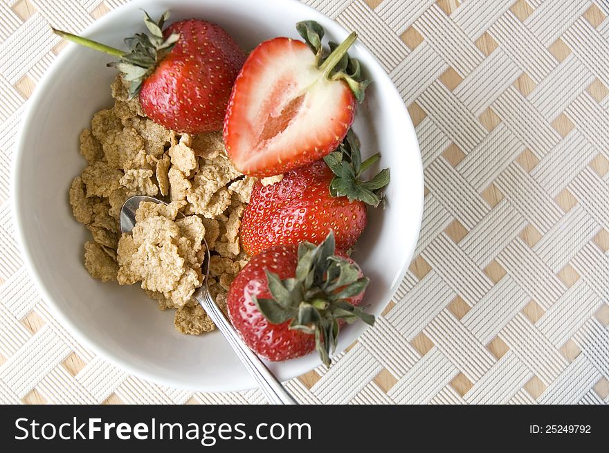 Cereal bowl with fresh strawberry on white background. Cereal bowl with fresh strawberry on white background