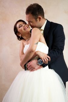 Bride And Groom Hugging In Empty Room Stock Images