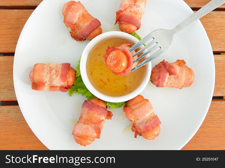 Deep Fired Sausage Wrapped With Bacon