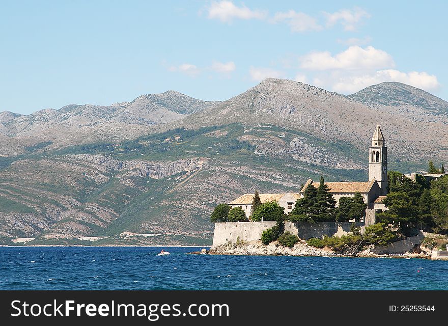 An ancient church on a background of mountains. An ancient church on a background of mountains