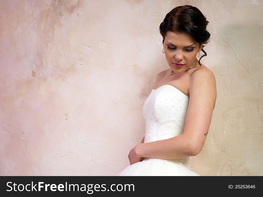 Bride with tattoo posing in the room. Bride with tattoo posing in the room