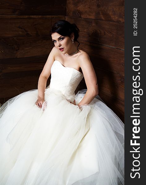 Bride with tattoo posing in the barn with hay. Bride with tattoo posing in the barn with hay