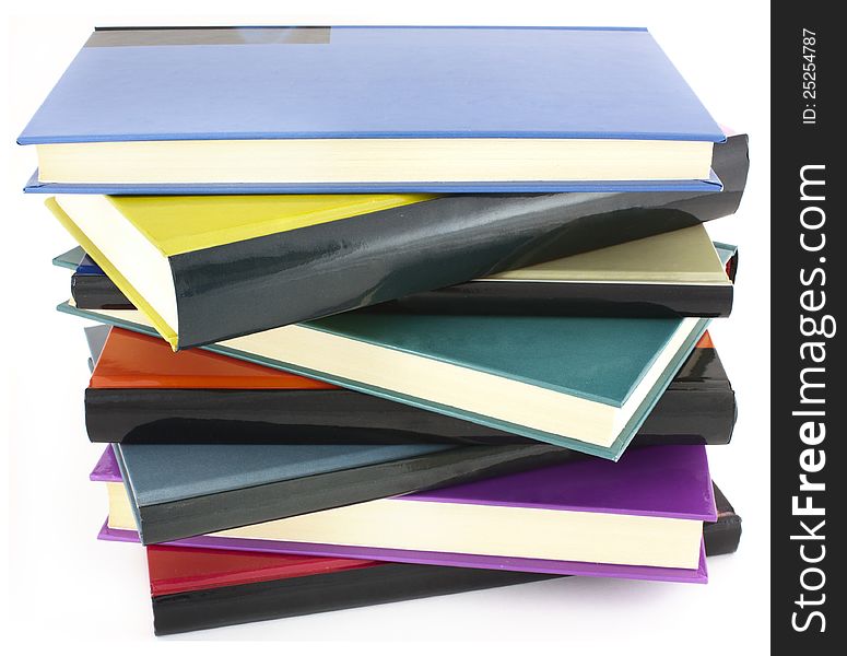 Pile of color hardcover books over white background. Pile of color hardcover books over white background
