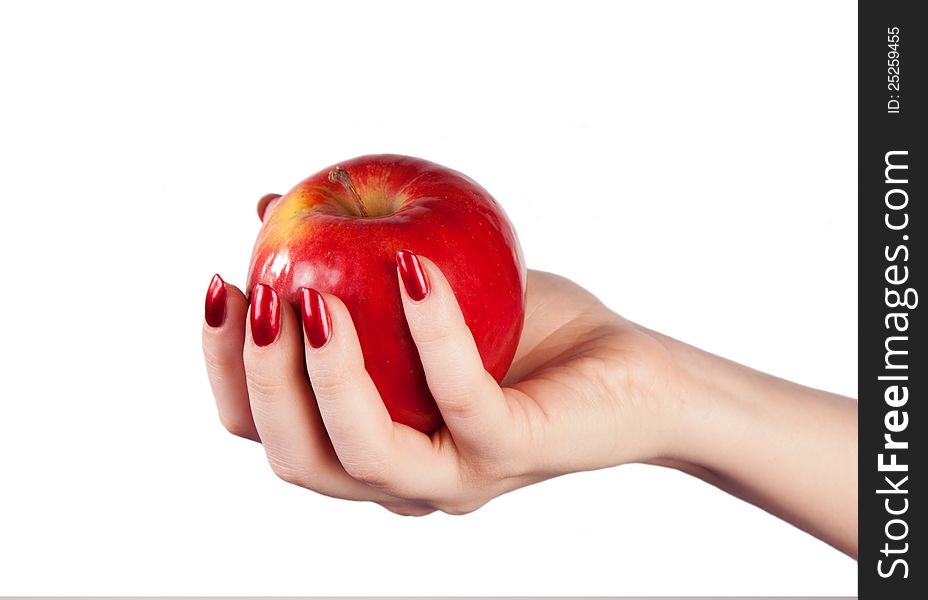 Fresh red apple in hand on a white background