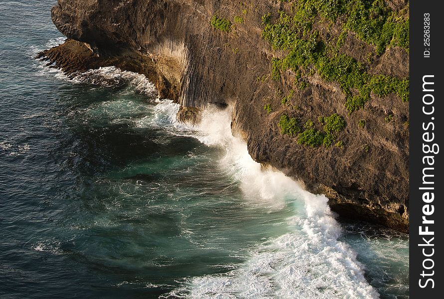 Waves crashing the cliffs at Uluwatu in Bali. Waves crashing the cliffs at Uluwatu in Bali.