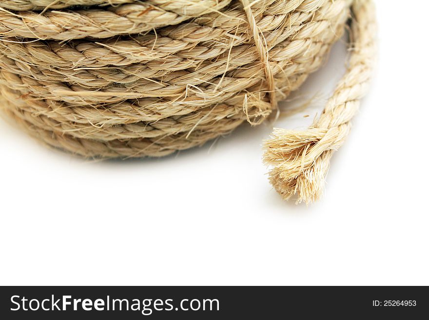 End of frayed rope over white background. End of frayed rope over white background