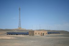 Wind Turbines And Solar Panels In Gobi Desert Stock Photo