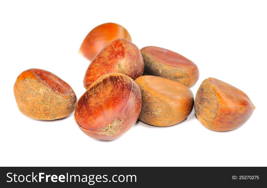 Seven chestnuts on a white background