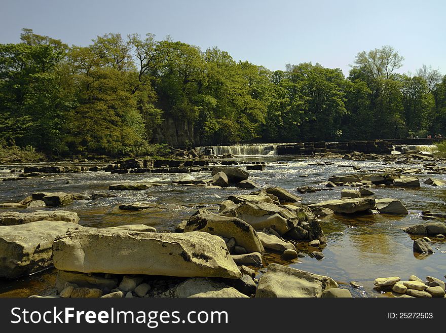 A view of Richmond waterfall on the river Swale from near the rocks