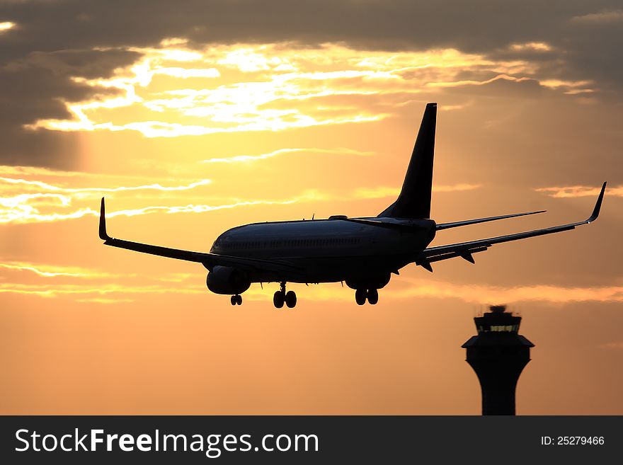 Passenger aircraft landing with dramatic sky in front