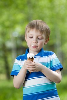Happy Kid Eating A Tasty Ice Cream Outdoor Stock Photos Happy Kid Eating A Tasty Ice Cream Outdoor Stock Photos