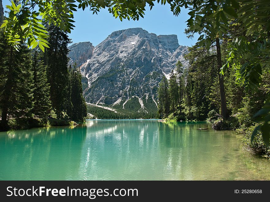 Great reflex and clear water in a lake in dolomite alps. Glacier on the background. Great reflex and clear water in a lake in dolomite alps. Glacier on the background.