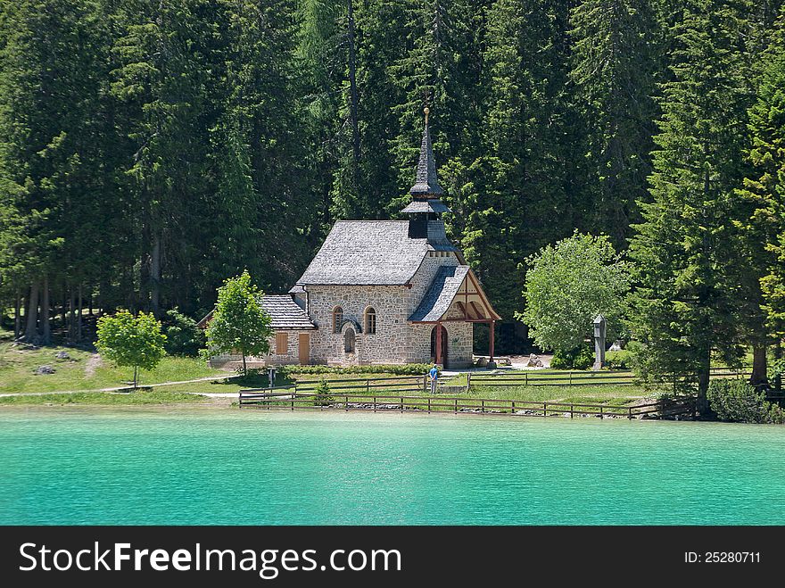 Romantic church in dolomite area with big mountains trees on the background. Romantic church in dolomite area with big mountains trees on the background