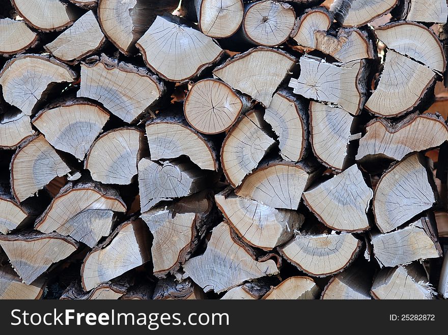 Close up of stacked, chopped wood. Close up of stacked, chopped wood.