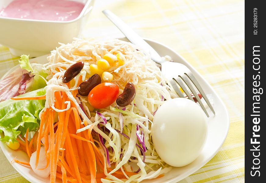Fresh salad with egg,carrot,red beans and cherry tomatoes
