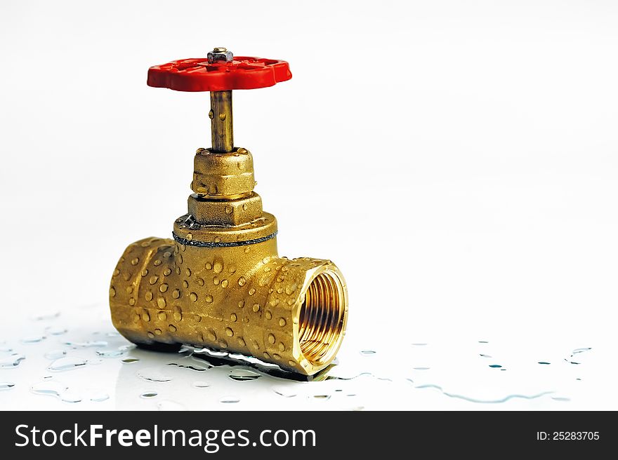 Shut-off valve with the red wheel. On a white background.