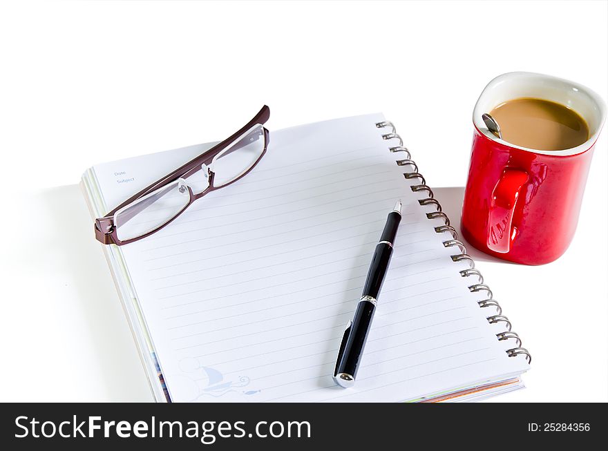 Notebook, pen, coffee red cup on the isolated background