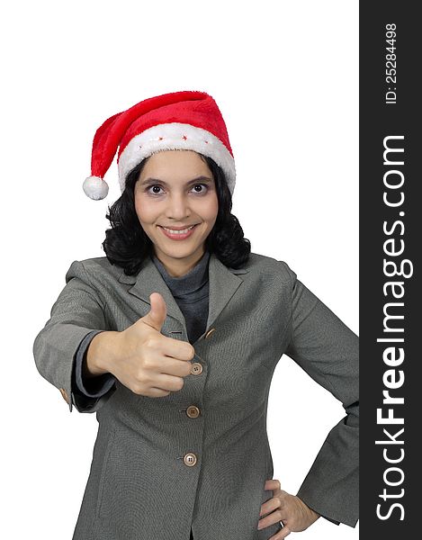 Mixed race business woman wearing santa hat, show her thumb isolated over white background. Mixed race business woman wearing santa hat, show her thumb isolated over white background