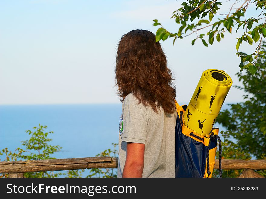 Portrait of a young handsome guy on the background of the summer seascape. Portrait of a young handsome guy on the background of the summer seascape